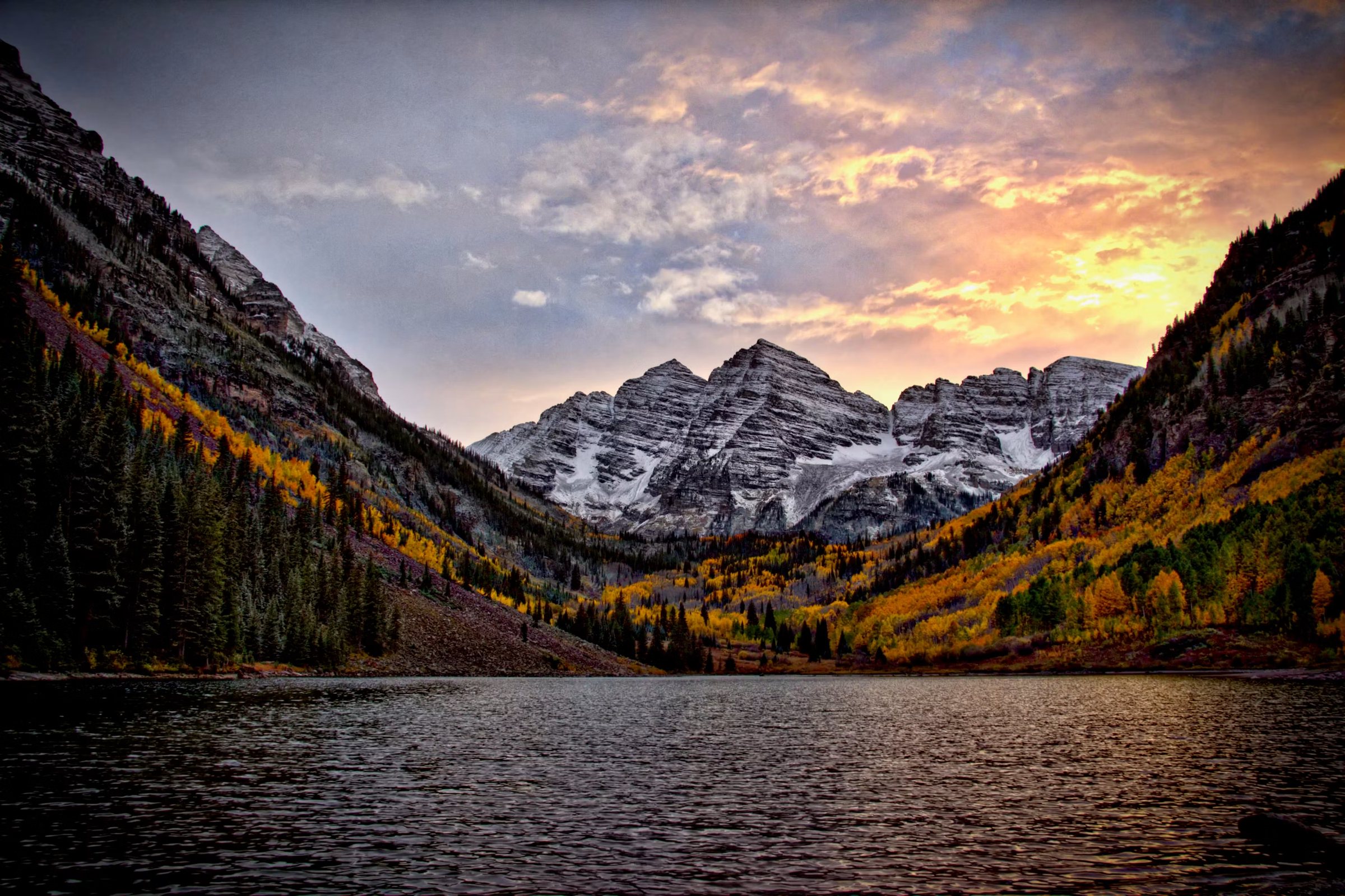 The Maroon Bells above Maroon Lake at sunrise in fall