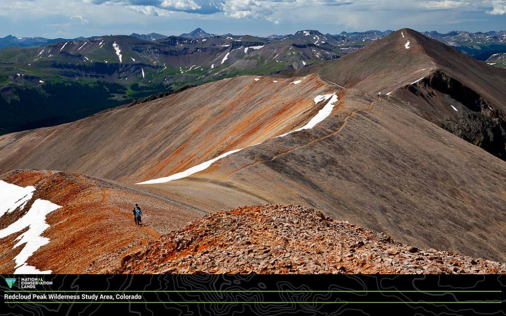 The red ridge between the saddle and the summit